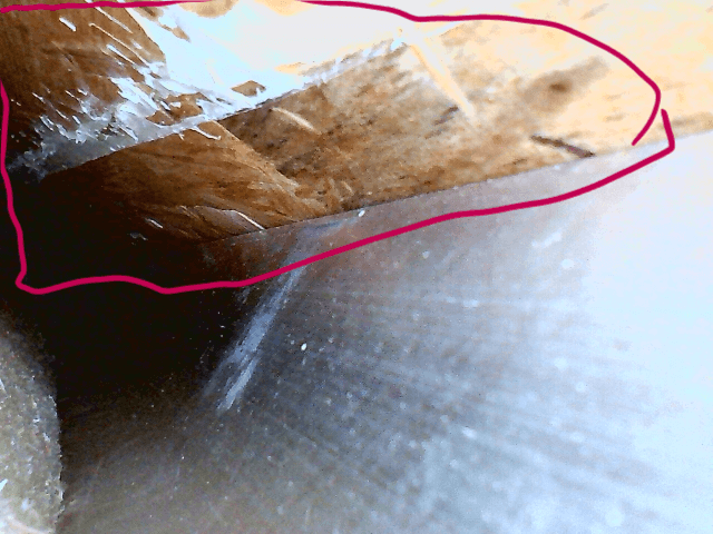 Fiber Optic Scope Picture of wet insulation under the floor in New Keystone Montana RV.